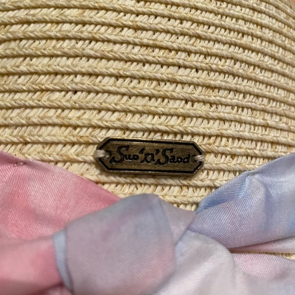 Sun “n” Sand floppy hat with light pink a smile blue bow and blue trim. UPF 50
